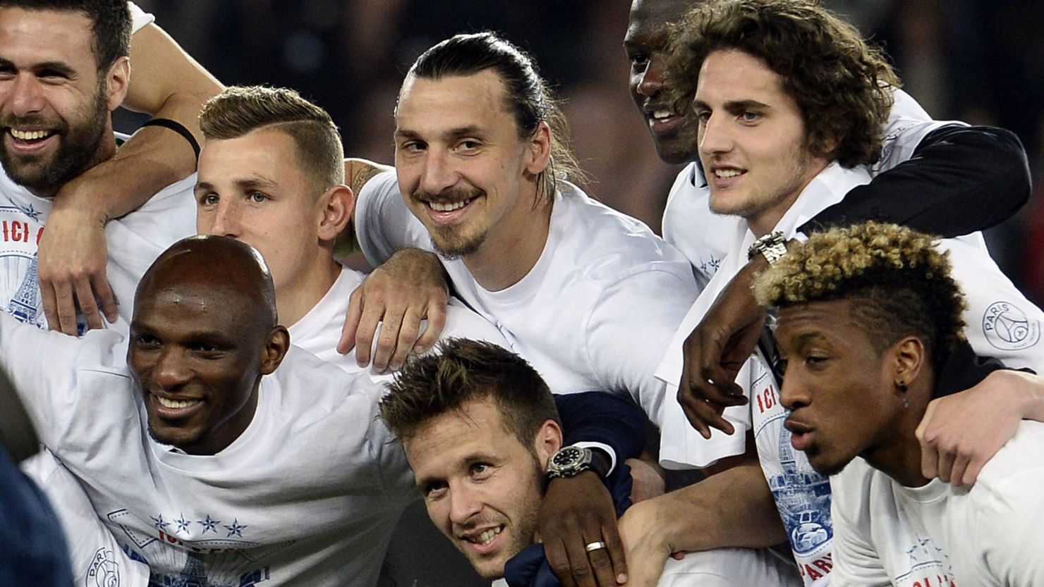 PSG's players celebrate after clinching the league title for the second season in succession.