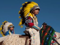 Youngsters learn to handle the ropes early, at the Crow Fair and Rodeo. - (Montana Office of Tourism)