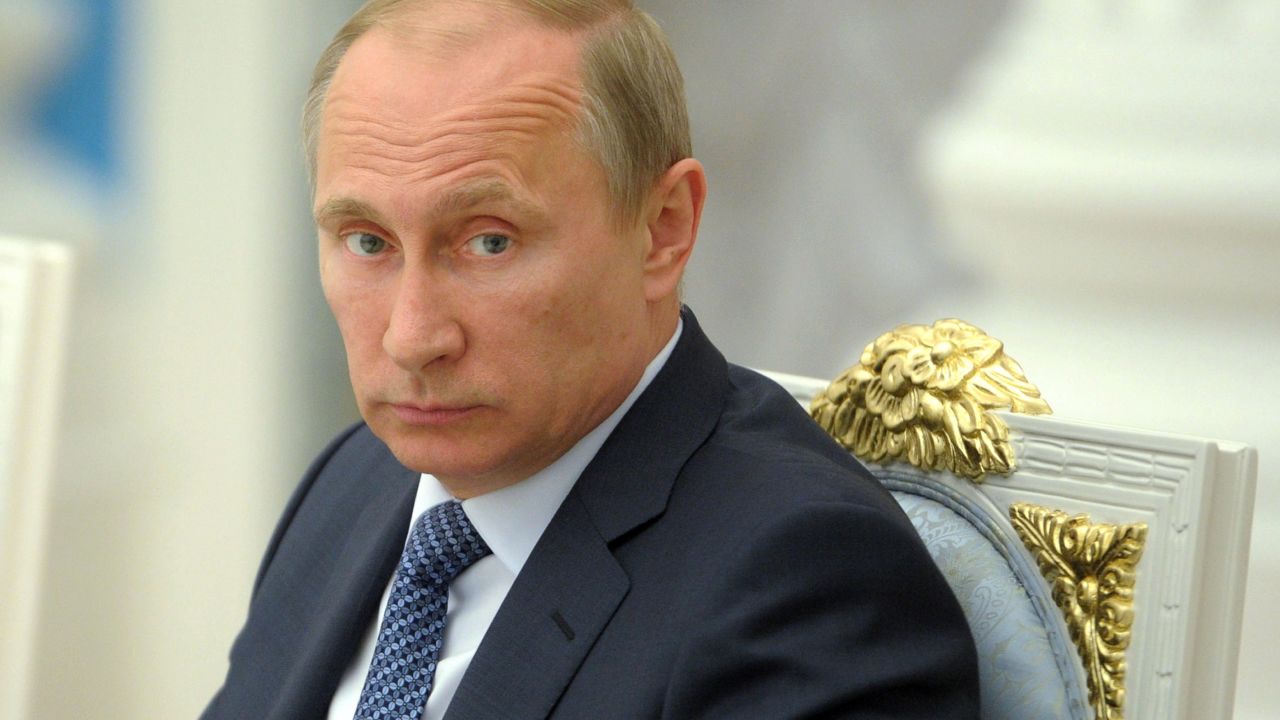 Russia's President Vladimir Putin looks on as he chairs a meeting at the Kremlin in Moscow, on May 7, 2014.