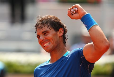 Rafael Nadal celebrates in typical style after completing his straight sets win over Jarkko Nieminen in Madrid.