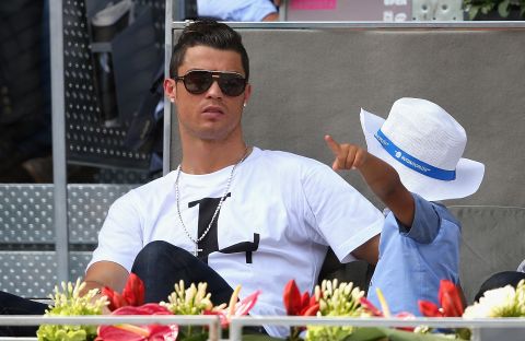 Real Madrid footballer Cristiano Ronaldo and his son Cristiano Ronaldo Jr. watch on as Nadal reaches the quarterfinals.