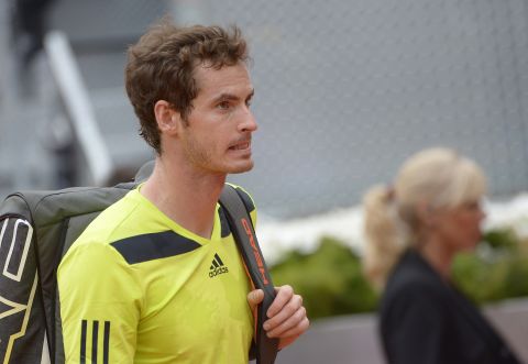 Wimbledon champion Andy Murray trudges off after his straight sets defeat to Santiago Giraldo. 