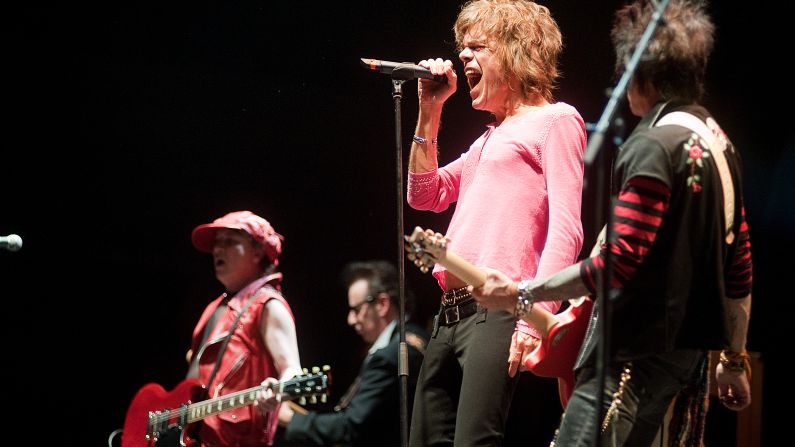 The New York Dolls formed in 1971, and helped drive the punk movement. According to The Rolling Stone Encyclopedia of Rock & Roll, their cross-dressing "captured the outrage and threat of glam." However, tragedy hit the group when drummer Billy Murcia died after suffocating when he mixed alcohol and pills in the band's first England tour. The band played support for Alice Cooper in 2011. Here, the New Yorks Dolls' David Johansen performs at London's Alexandra Palace on October 29, 2011.