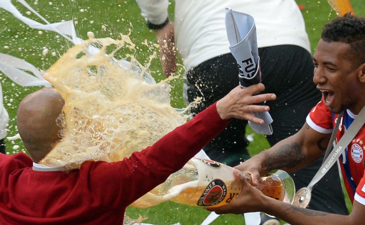 Bayern boss Pep Guardiola receives the traditional beer shower as his side celebrate a 24th Bundesliga title.