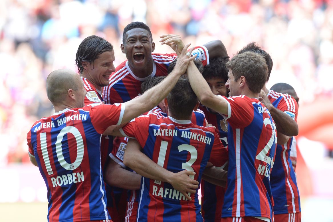 Bayern players surround Claudio Pizarro after his injury time winner in the 1-0 victory over Stuttgart.