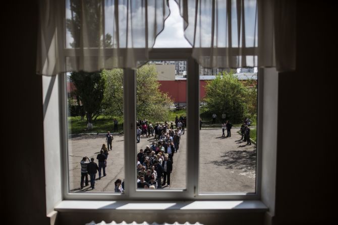 Ukrainians line up to cast their votes at a polling station in Donetsk on May 11.