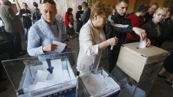 Ukrainians vote during a referendum at a polling station in Donetsk, Ukraine, 11 May 2014. Residents of eastern Ukraine began voting on an independence referendum that was organized by pro-Russian separatists and rejected by the government in Kiev. Russian-speakers and supporters of Moscow have been rallying in the region since March, when a referendum on independence led to Russia's annexation of Crimea.