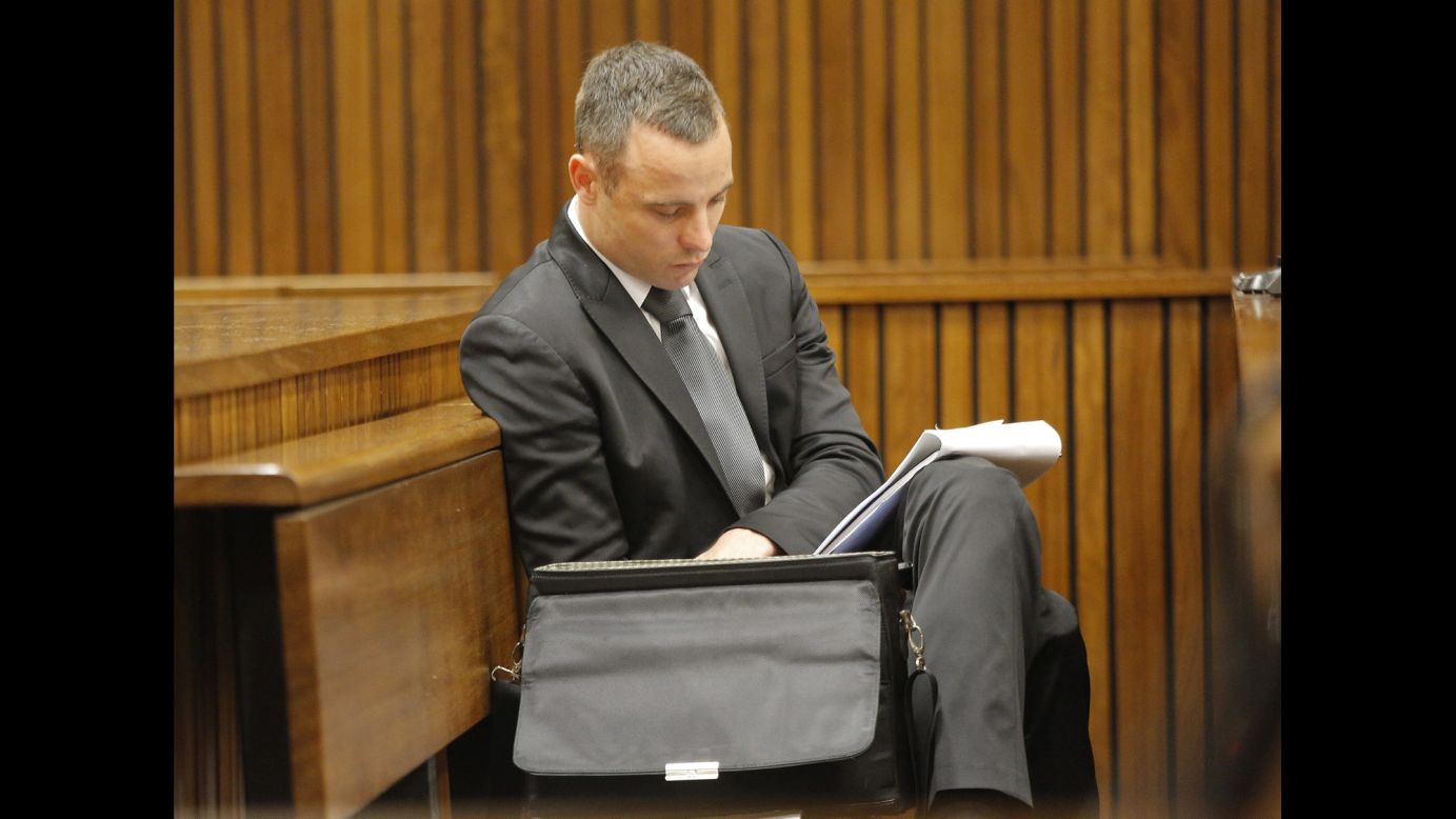 Pistorius reads notes during his trial on Monday, May 12. 