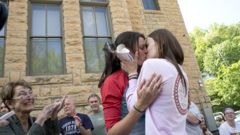 Jennifer Rambo, right, kisses her Kristin Seaton after their marriage ceremony in front of the Carroll County Courthouse in Eureka Springs, Arkansas, on May 10, 2014. Rambo and Seaton were the first same-sex couple to be granted a marriage license in Eureka Springs after a judge overturned Amendment 83, which banned same-sex marriage in Arkansas. 