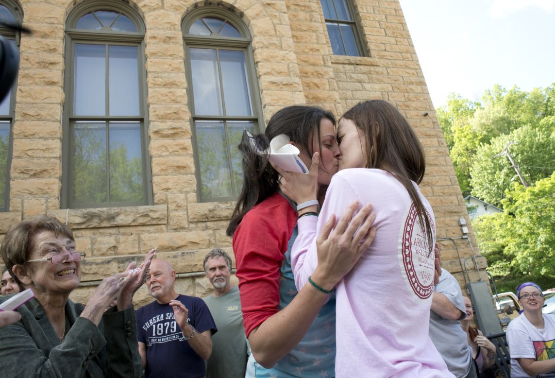 Jennifer Rambo, right, kisses her Kristin Seaton after their marriage ceremony in front of the Carroll County Courthouse in Eureka Springs, Arkansas, on May 10, 2014. Rambo and Seaton were the first same-sex couple to be granted a marriage license in Eureka Springs after a judge overturned Amendment 83, which banned same-sex marriage in Arkansas. 