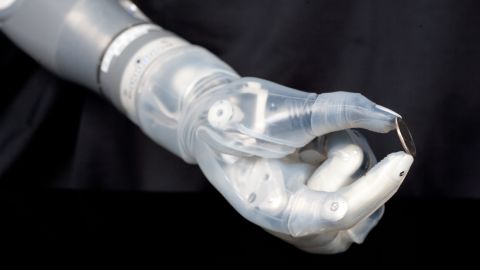 The DEKA bionic arm can control multiple joints simultaneously to pick up small objects such as this coin.