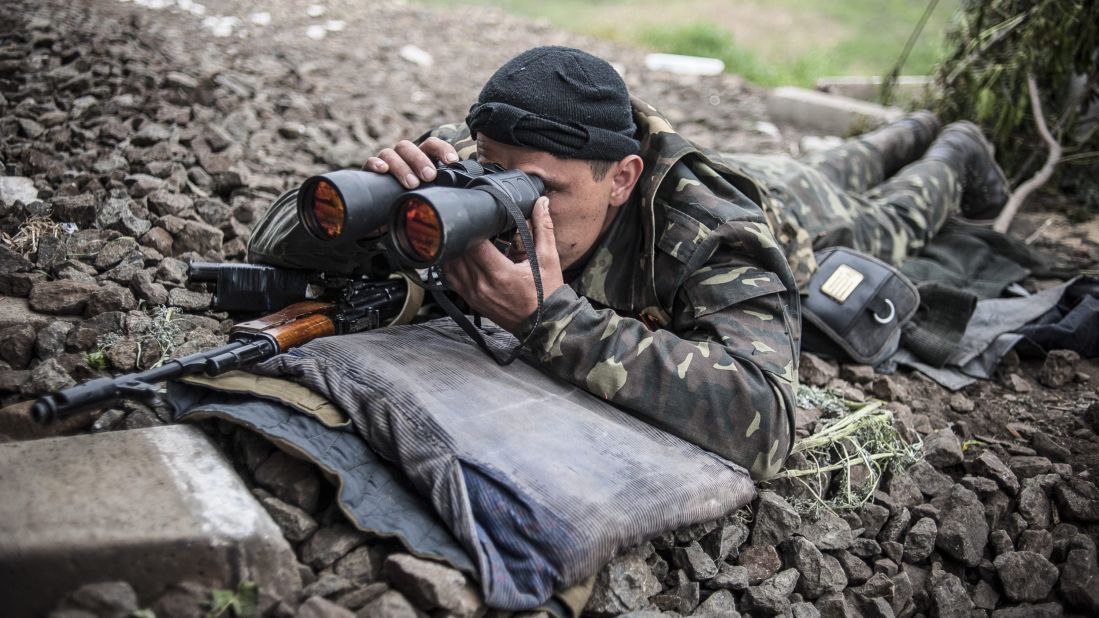 An armed pro-Russian separatist takes up a position near Slovyansk on May 12.