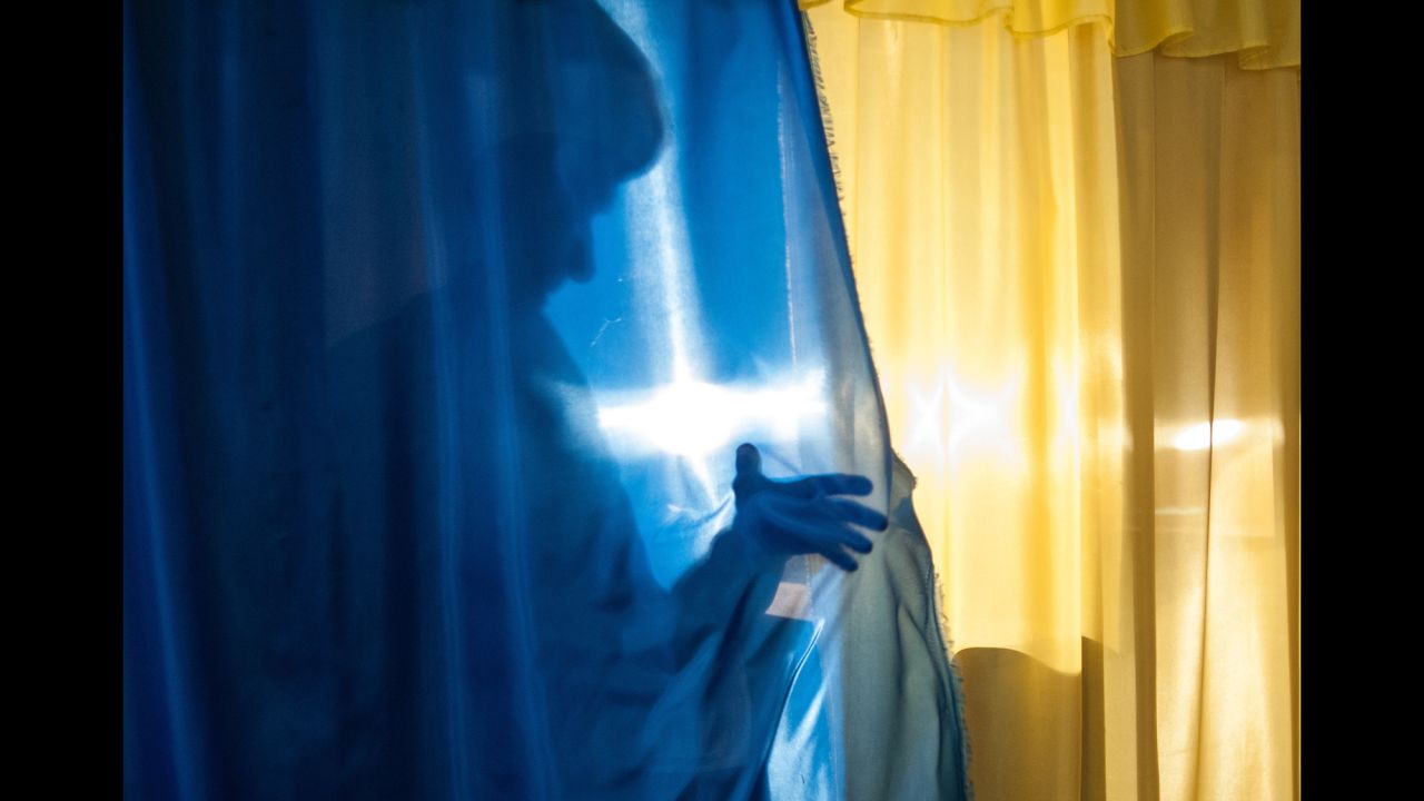 A person leaves a voting booth in Luhansk, Ukraine, on May 11. The Donetsk and Luhansk regions of eastern Ukraine voted on controversial referendums to declare independence from the government in Kiev. Acting Ukrainian President Oleksandr Turchynov called the vote "propagandist farce."