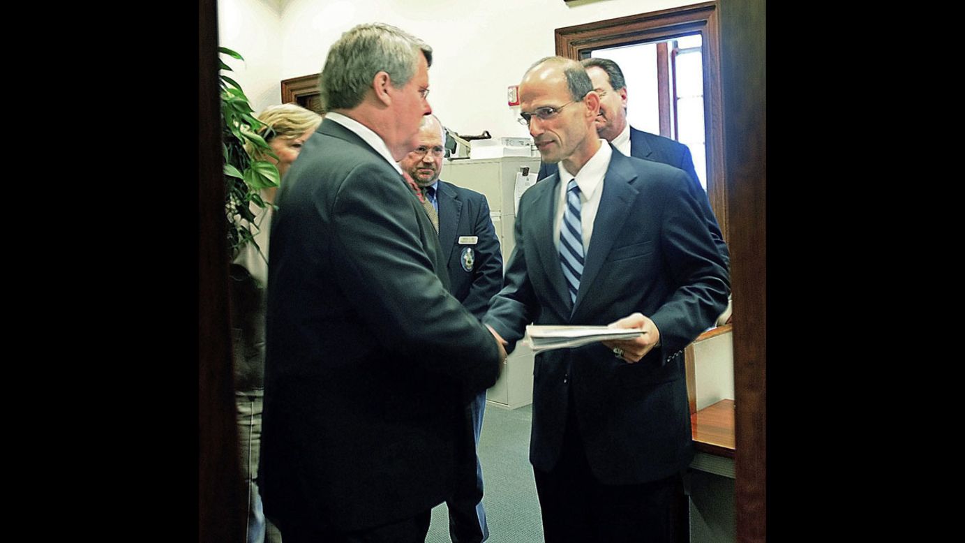 In May 2009, Maine state Sen. Dennis Damon, left, hands Gov. John Baldacci the bill that the state Senate passed to affirm the right of same-sex couples to marry.
