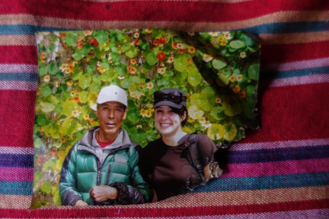 The only photograph of deceased Sherpa Ang Tshiring left in his family's home shows him together with a trekking client. The family sent his pictures, together with rice, butter and salt, to several monasteries to request monks perform puja (prayers) in his memory.