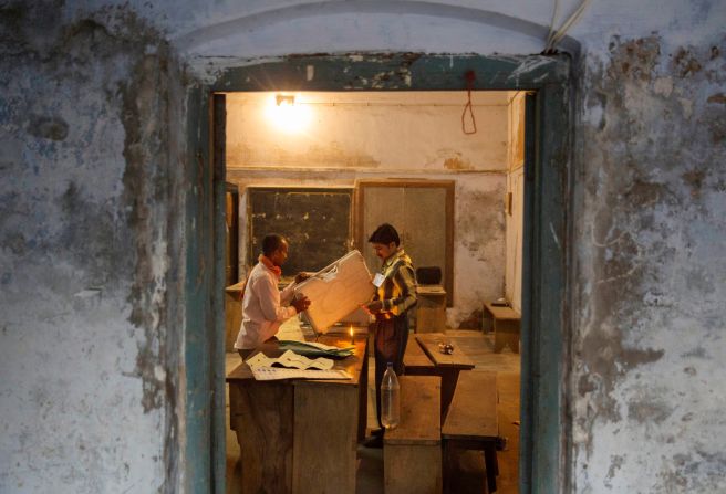 Election workers prepare to seal an electronic voting machine after the final polls closed on May 12 in Varanasi.