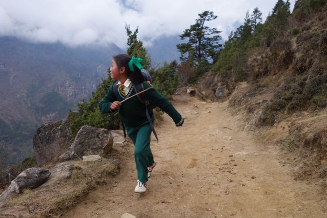 The Sherpas consider education the most important opportunity they have to live a better life. Every day, third-grader Nimga Sherpa walks down the valley from her village to attend classes at a school in Namche Baazar, one hour away. 