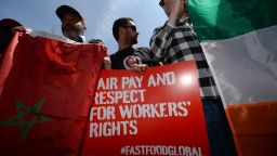Fast-food workers from around the world stage a protest in front of a McDonald's restaurant, campaigning for higher pay, in New York, May 7, 2014. Fast-food workers from a dozen countries held a demonstration to annouce a strike in the US on May 15, 2014 and demonstration at fast-food restaurants around the world, demanding a 15 USD per hour minimum wage for workers in the US. AFP PHOTO/Emmanuel Dunand (Photo credit should read EMMANUEL DUNAND/AFP/Getty Images