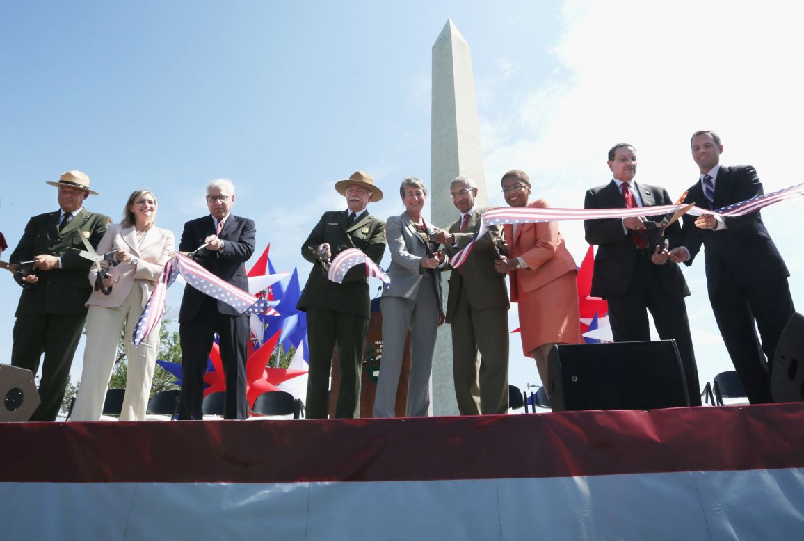 The Washington Monument is reopening after a 2011 earthquake caused $15 million in damage. Cutting the ribbon Monday, May 12, were, from left, National Mall and Memorial Parks Superintendent Robert Vogel; Caroline Cunningham, president of the Trust for the National Mall; David Rubenstein, co-founder and co-CEO of the Carlyle Group; National Park Service Director Jonathan Jarvis; U.S. Interior Secretary Sally Jewell; counselor to President Obama John Podesta; Rep. Eleanor Holmes Norton, D-D.C.; and D.C. Mayor Vincent Gray (with unidentified man).