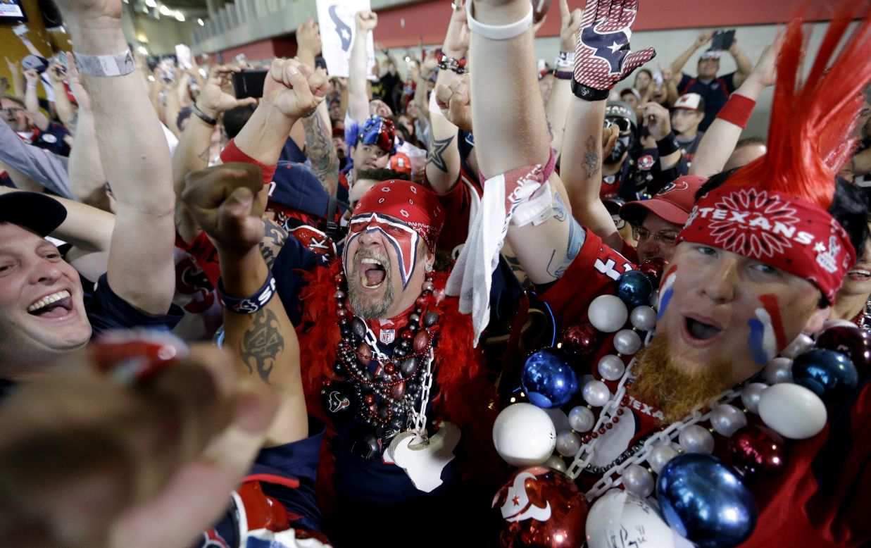 Houston Texans fans celebrate after the Texans picked South Carolina defensive end Jadeveon Clowney as the No. 1 overall pick in the NFL draft on Thursday, May 8.