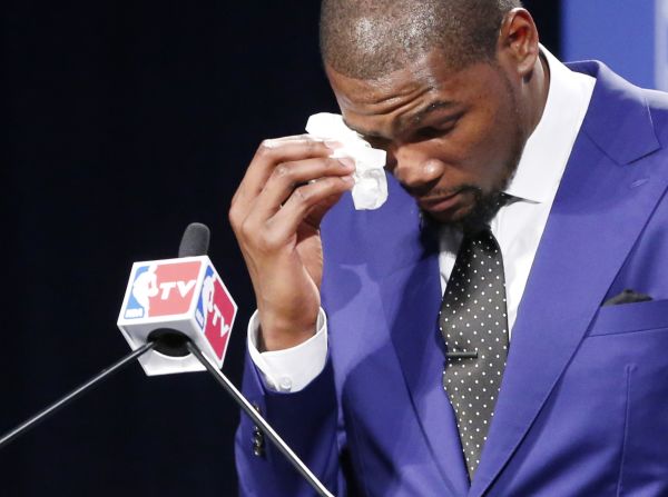 Oklahoma City Thunder's <a href="index.php?page=&url=http%3A%2F%2Fwww.cnn.com%2Fvideo%2Fdata%2F2.0%2Fvideo%2Fsports%2F2014%2F05%2F07%2Fsot-kevin-durant-mvp-speech.nba-tv.html">Kevin Durant gets emotional</a> during his speech after he won the NBA's most valuable player award on Tuesday, May 6. He elicited a standing ovation when he spoke of the hardships his mother endured. "You're the real MVP," Durant said to her as she sat in the audience crying. 
