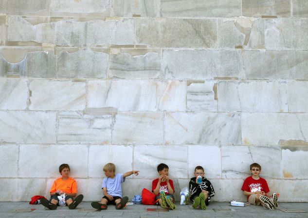 Recent repairs are visible as visiting fifth-graders have lunch in the shade. From left are Jacob Smith-Osborn, Dom Balzano, Jiashu Chen, James Downs and Alex Musshorn.