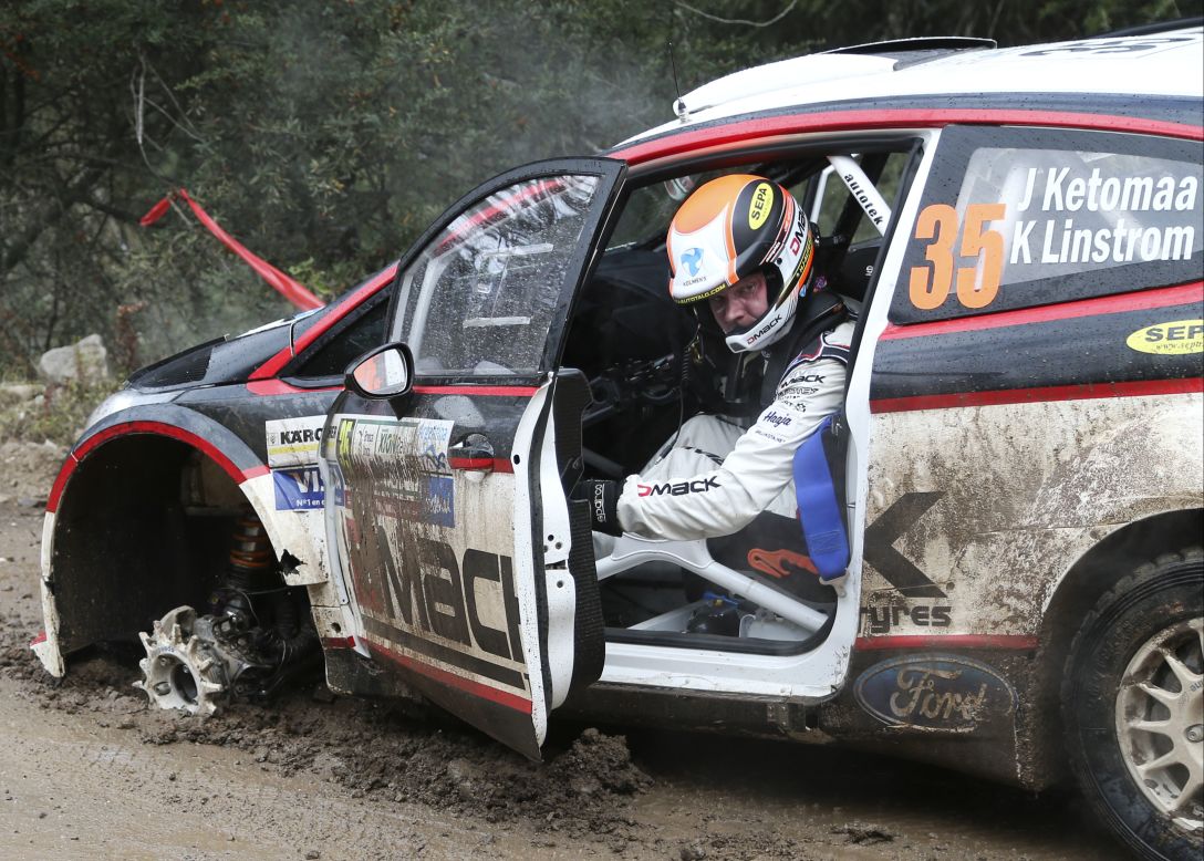 Jari Ketomaa of Finland gets out of his damaged Ford Fiesta after blowing a front tire on Friday, May 9, the first day of the FIA WRC Argentina Rally in Agua de Oro, Argentina.