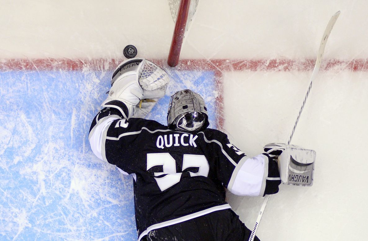 Los Angeles Kings goalie Jonathan Quick reaches for the puck after being scored on by Anaheim Ducks right wing Teemu Selanne in Game 3 of an NHL second-round Stanley Cup playoff series in Los Angeles on Thursday, May 8. The Ducks won 3-2.
