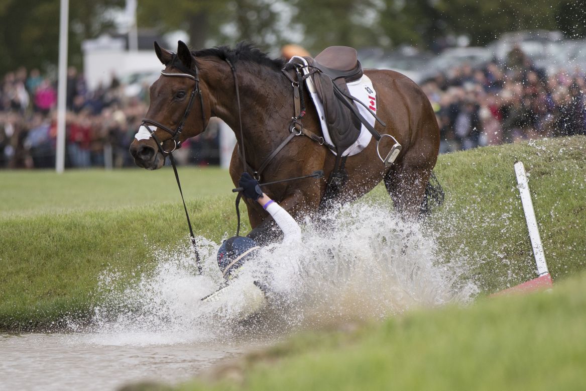 Canadian rider Rebecca Howard falls from her horse, Riddle Master, on the penultimate day of the Badminton Horse Trials on Saturday, May 10. The Badminton Horse Trials, which were first held in 1949, take place over six days on the Duke of Beaufort's Badminton Estate in England.