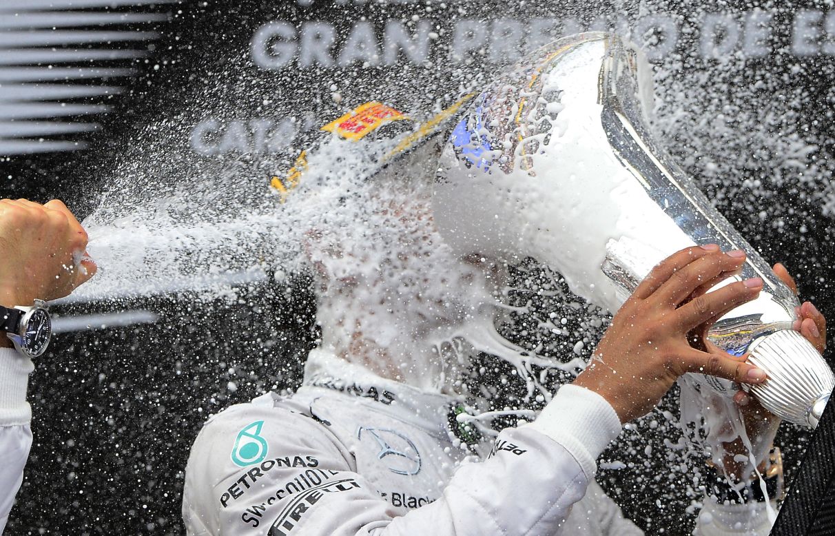 Mercedes driver Lewis Hamilton of Britain celebrates on the podium after winning the Spain Formula One Grand Prix at the Barcelona Catalunya racetrack in Montmelo, Spain, on Sunday, May 11.