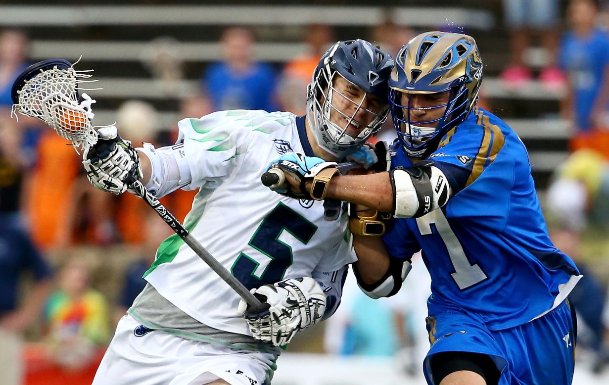 Kyle Dixon of the Chesapeake Bayhawks, left, runs into Jake Tripuka of the Charlotte Hounds during a game at American Legion Memorial Stadium in Charlotte, North Carolina, on Saturday, May 10.