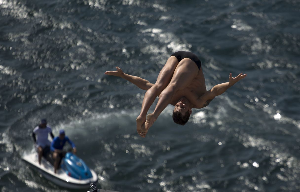 An athlete dives from a Red Bull Cliff Diving World Series platform during a training session in Havana, Cuba, on Thursday, May 8.