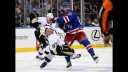 Sidney Crosby #87 of the Pittsburgh Penguins is checked by Chris Kreider #20 of the New York Rangers during Game Four of the Second Round in the 2014 NHL Stanley Cup Playoffs at Madison Square Garden on May 7, 2014 in New York City. 