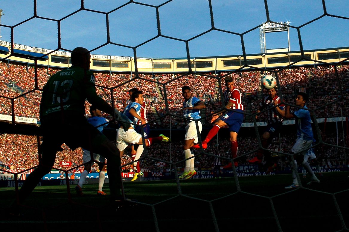 Toby Alderweireld of Atletico de Madrid scores the opening goal with a header during the La Liga match against Malaga CF at Vicente Calderon Stadium in Madrid, Spain, on Sunday, May 11.