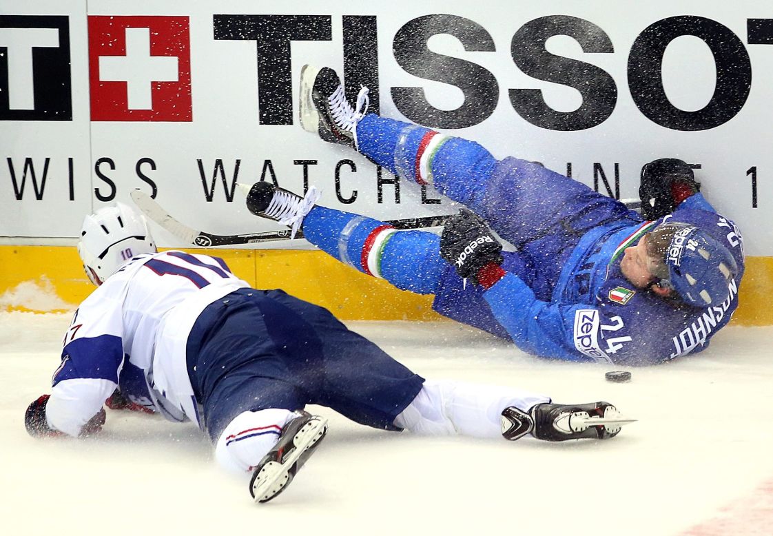 Laurent Meunier of France, left, crashes with Trevor Johnson of Italy during an Ice Hockey World Championship match at the Chizhovka Arena in Minsk, Belarus, on Sunday, May 11.