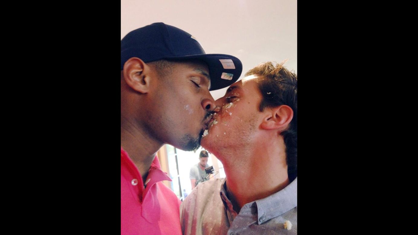 Michael Sam, left, and boyfriend Vito Cammisano kiss at an NFL draft party in San Diego on Saturday, May 10. Sam was selected in the seventh round, 249th overall, by the St. Louis Rams, becoming the first openly gay player drafted into the NFL. <a href="https://twitter.com/Vitcamm/status/465325561402101760" target="_blank" target="_blank">His boyfriend tweeted</a> a photo of their kiss and said he was "so proud and happy."