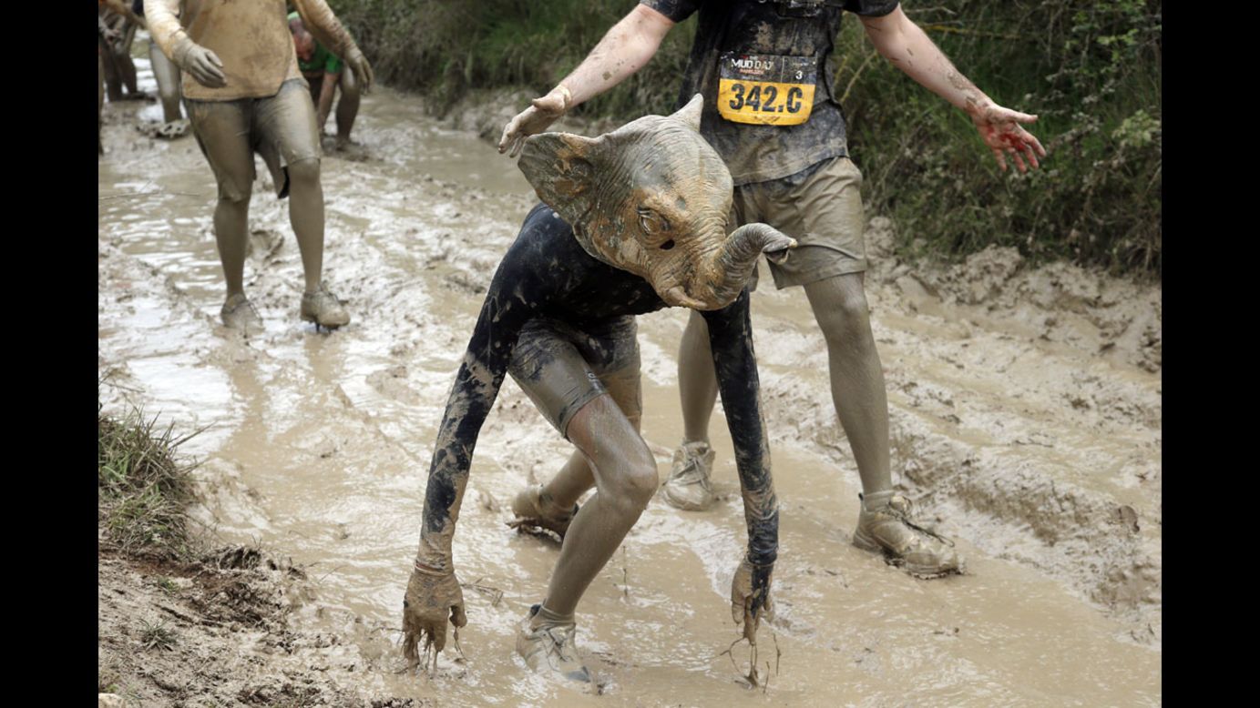 A Mud Day participant wearing an elephant mask competes in Beynes, France, on Thursday, May 8. The eight-mile course had more than 20 obstacles, most of them set in mud.