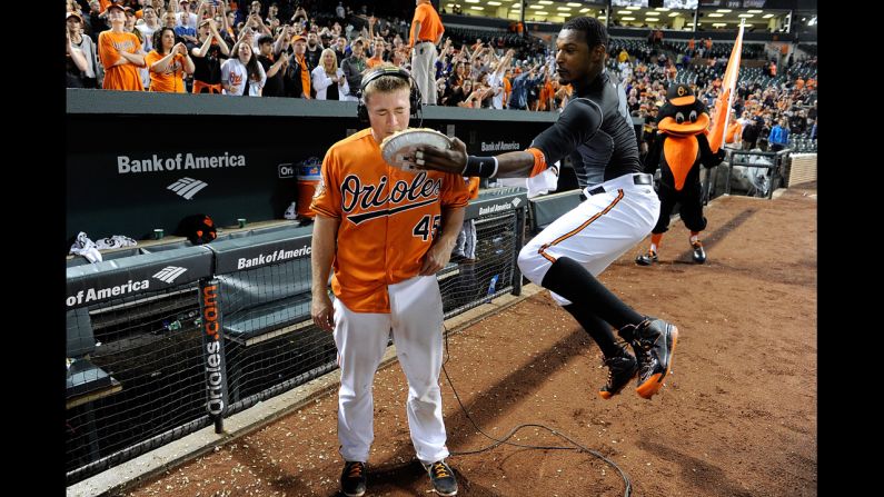 Steve Clevenger of the Baltimore Orioles is hit with a pie by Adam Jones after driving in the game-winning run in the 10th inning against the Houston Astros in Baltimore on Saturday, May 10. The Orioles won 5-4.