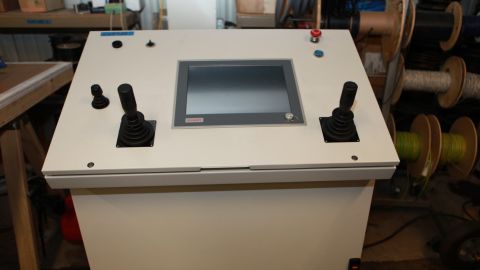Engineers can control the robot arm remotely from this command console, allowing them to remain safe from harmful radiation.