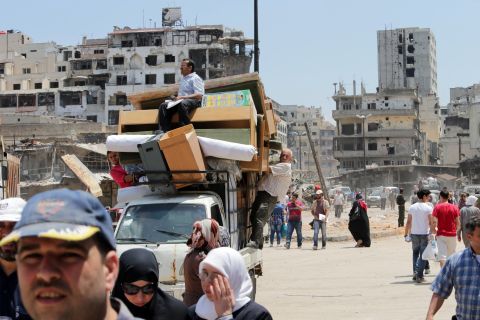 Residents return to the Old City of Homs, Syria, on Monday, May 12, 2014. A truce between the Syrian government and rebel forces in the strategic and symbolic city <a href="http://www.cnn.com/2014/05/07/world/meast/syria-truce-explain/index.html">has gone into effect</a>, allowing many of its residents to come home for the first time in nearly two years. Homs has experienced some of the worst of the violence in <a href="http://www.cnn.com/2013/08/27/world/meast/syria-civil-war-fast-facts/index.html">a bloody civil war</a> that has left more than 100,000 people dead and driven millions of people from their homes across the country.