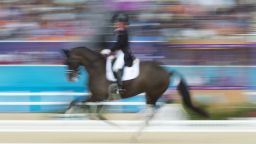 Britain's Charlotte Dujardin competes in the team Dressage Grand Prix event of the 2012 London Olympics at the Equestrian venue in Greenwich Park, London, August 7, 2012. AFP PHOTO / JOHN MACDOUGALL