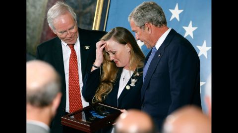 President George W. Bush presents the Medal of Honor to Daniel and Maureen Murphy, parents of Navy Lt. Michael Murphy, in October 2007. Murphy, a Navy SEAL, was killed June 28, 2005, when his four-man team was assaulted by 30 to 40 enemy fighters. Murphy exposed himself to repeated enemy fire while trying to radio for help for his besieged team, his citation said.