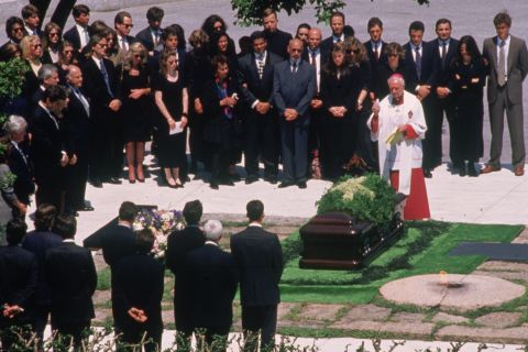 Jacqueline Kennedy Onassis is laid to rest beside her husband, John F Kennedy, at Arlington National Cemetery on May 23, 1994.