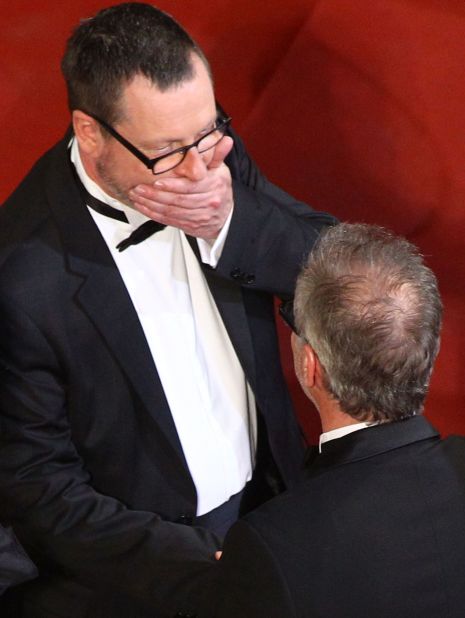 Lars von Trier claps his hand across his mouth at Cannes in 2011. Perhaps he is reliving the moment he sympathized with Hitler.