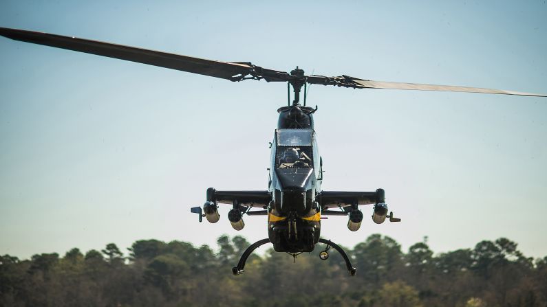 A retired Cobra AH-1 helicopter from the Army Aviation Heritage Foundation lands at the Columbus, Georgia, airport before a weekend air show on Friday, March 14.