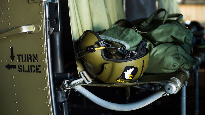 A helmet rests in the cockpit of a Huey helicopter that was in service during the war in Vietnam at the Henry County Airport.