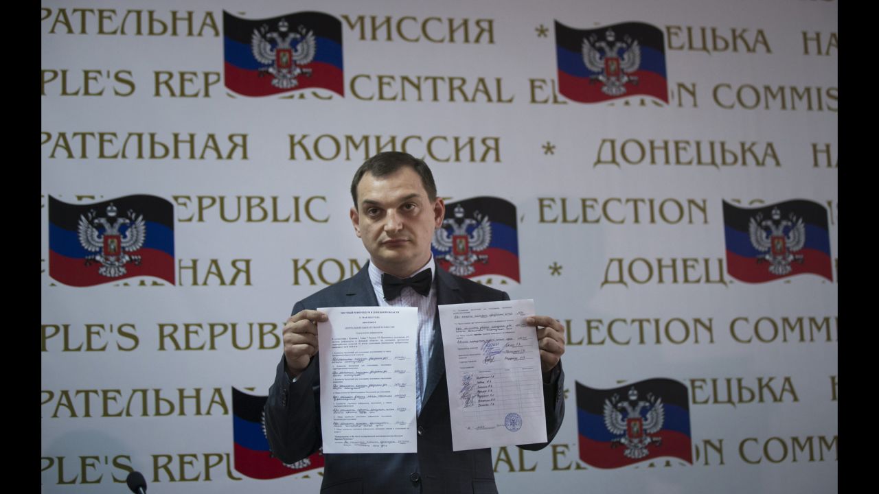 Roman Lyagin, a member of a rebel election commission, shows referendum results to journalists at a May 12 news conference in Donetsk. Pro-Russian separatists staged the referendum asking residents in the Donetsk and Luhansk regions whether they should declare independence from Ukraine.  