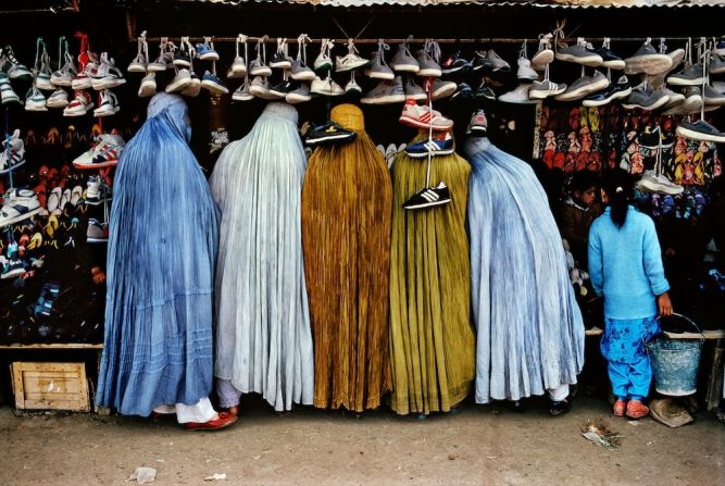 Afghan women shop at a shoe store in Kabul, 1992.
