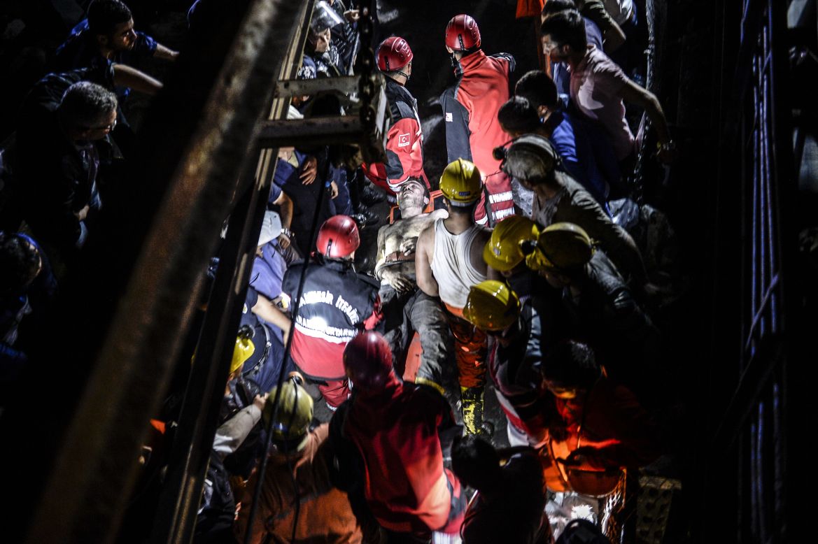 An injured miner is carried out by rescue workers. The mine shaft is about two-thirds of a mile -- or 1 kilometer -- underground, a disaster agency said.