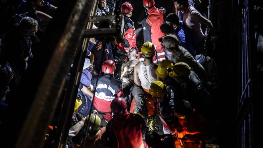An injured miner is carried out by rescue workers on May 13. The mine shaft is about two-thirds of a mile -- or 1 kilometer -- underground, a disaster agency said.